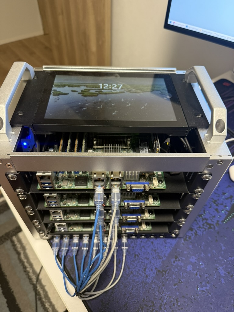 Top-down view of the rack with wiring and the monitor active